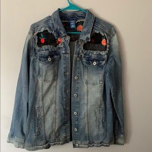 A denim jacket with black net floral accent
